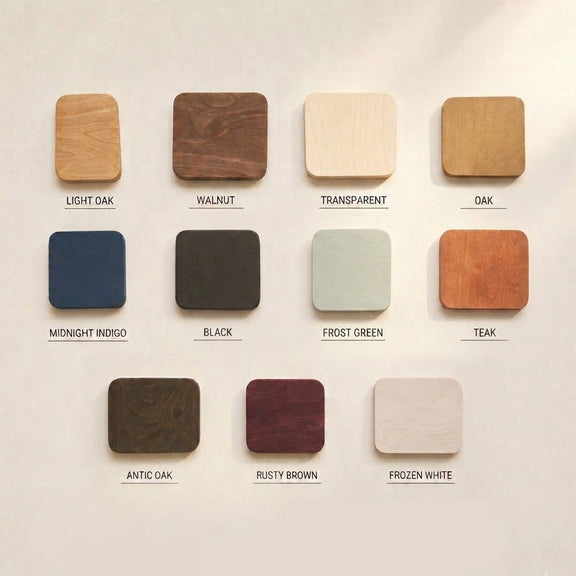 Jedenaście próbek sklejki brzozowej olejowanej ręcznie: light oak, walnut, transparent, oak, midnight indigo, black, frost green, teak, antic oak, rusty brown, frozen white