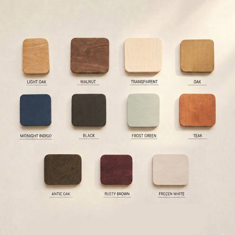 Jedenaście próbek sklejki brzozowej olejowanej ręcznie: light oak, walnut, transparent, oak, midnight indigo, black, frost green, teak, antic oak, rusty brown, frozen white
